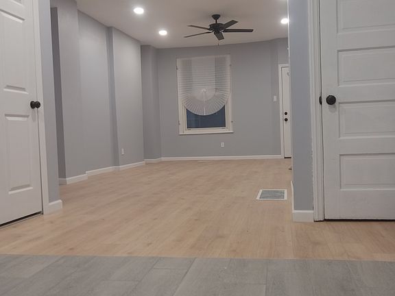 First floor, Looking from the kitchen to the front of the house. The bathroom door is on the left and basement door is on the right.