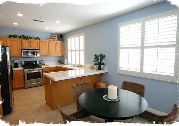 The kitchen has an open layout and flows into the family room