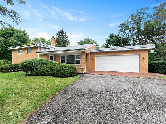 Attached Garage With Driveway Off Side Street