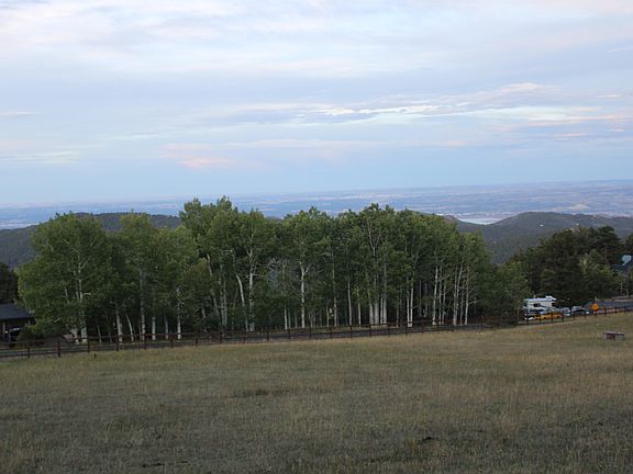 View of ranch pasture and Denver