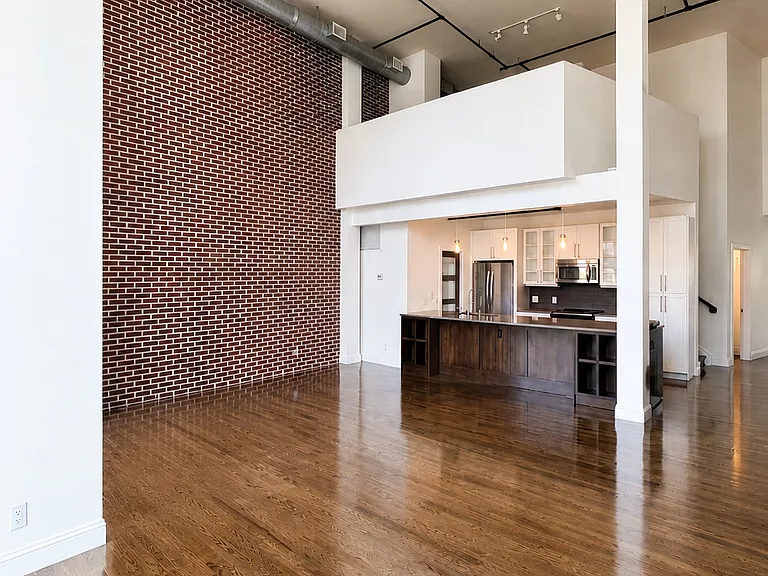 Expansive living room highlighting the architectural loft character.
