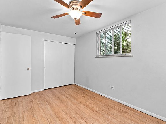 Back Bedroom facing door and closet.