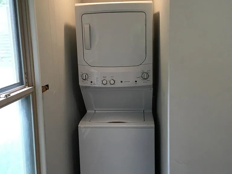 Washer and dryer in spacious mudroom area.