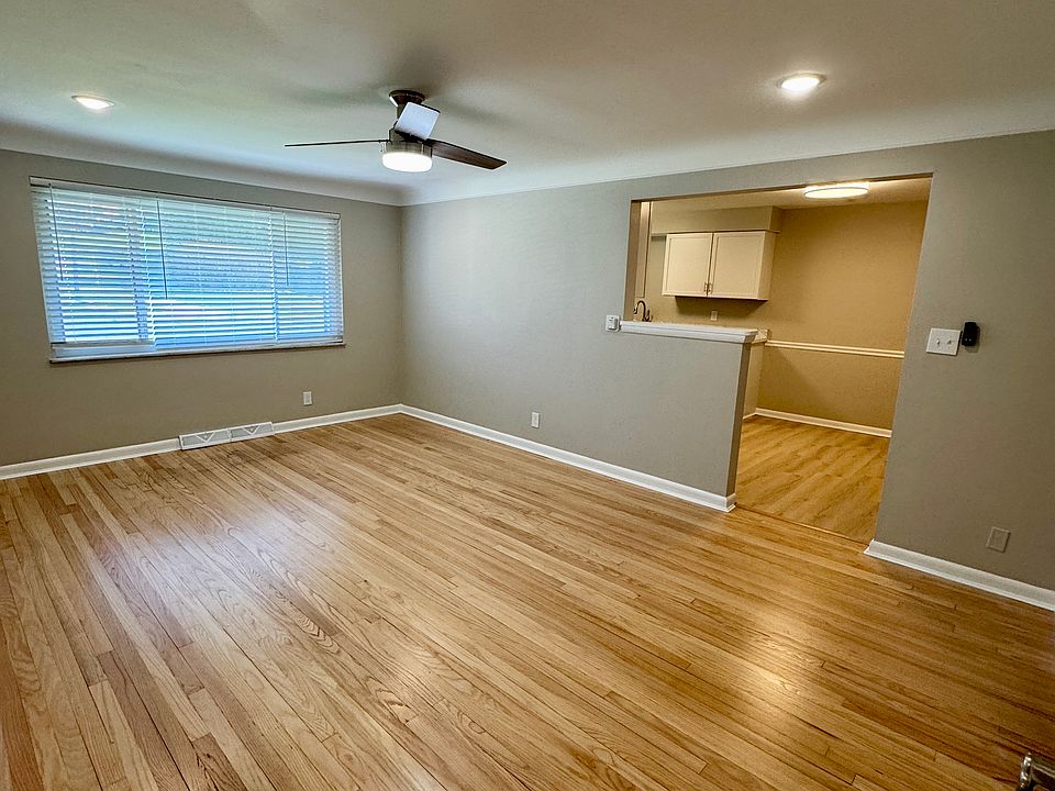 Living room features completely refinished genuine hardwood floors.