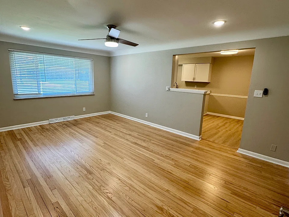 Living room features completely refinished genuine hardwood floors.