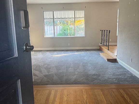 Entry to large living/family room with dining area to the right