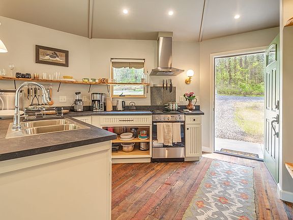 A generous kitchen equipped for the amateur chef, ready to enjoy your local farmer's market haul