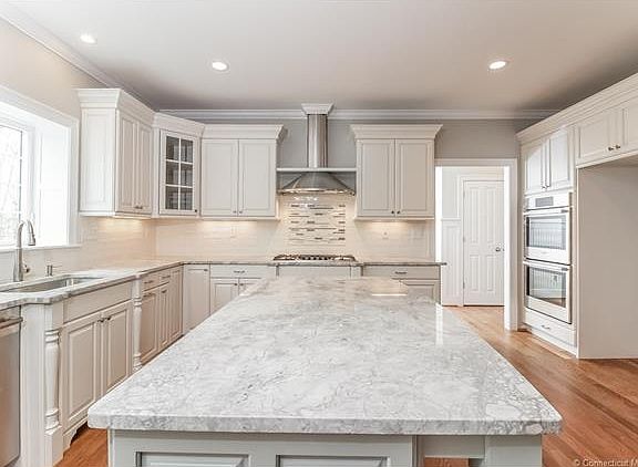 Large island sits 4 stools,...