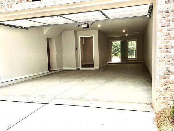 Tandem, 3 Car Garage with Back Yard Access