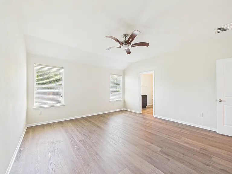 Primary looks over generous back yard