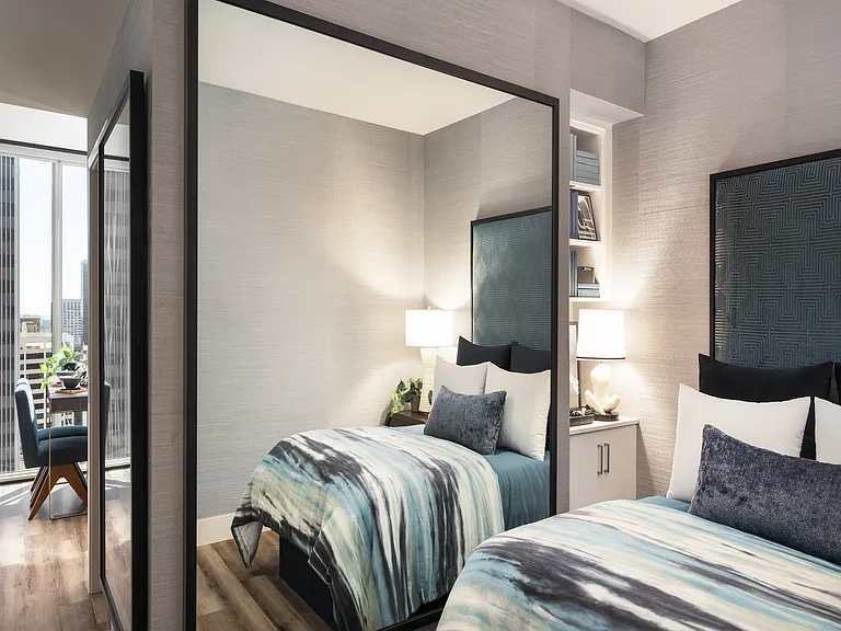 Luxurious bedroom with elegant decor, featuring a plush bed with blue and green accents, modern lighting, and a floor-to-ceiling window offering stunning city views.