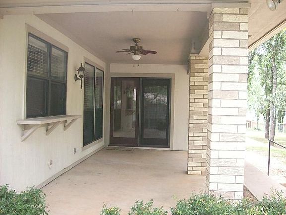 covered patio with fan and serving bar