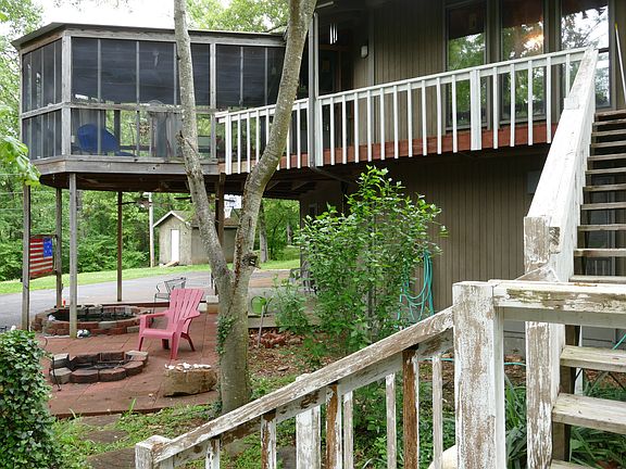 Porch, fire pit, and pond