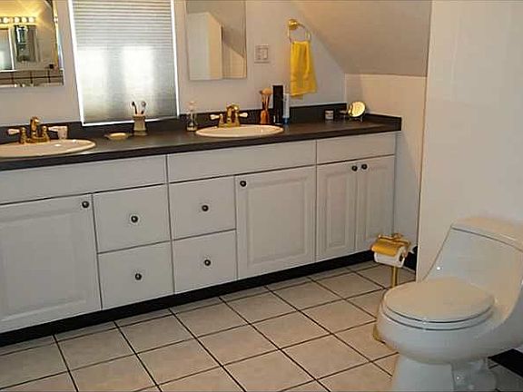 Spacious Bathroom with His and Her Sinks