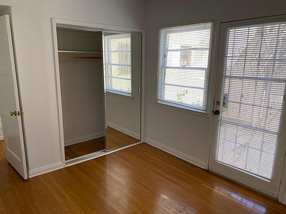 Bedroom with back door to private patio