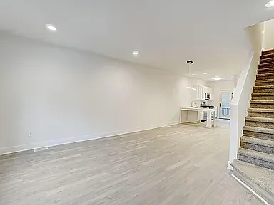 great room without virtual furniture-massive space all on one level in case you want to host a very large dinner party