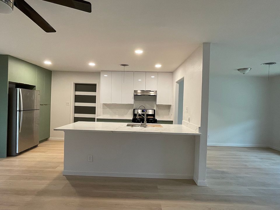 new modern kitchen opens to family room, with plenty storage
