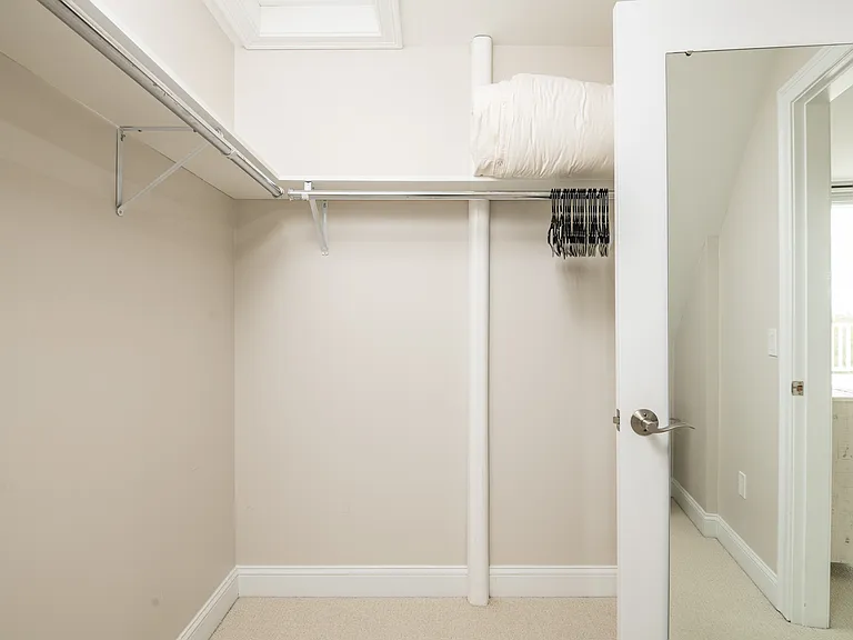 the master bedroom walk-in closet