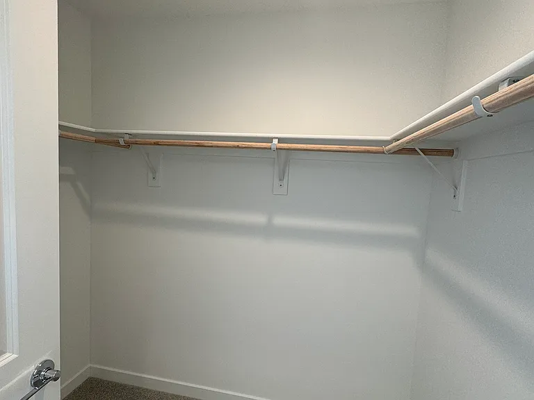 "Hers" Walk-in closet