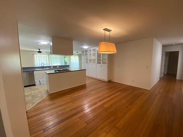 looking into the dining and kitchen areas
