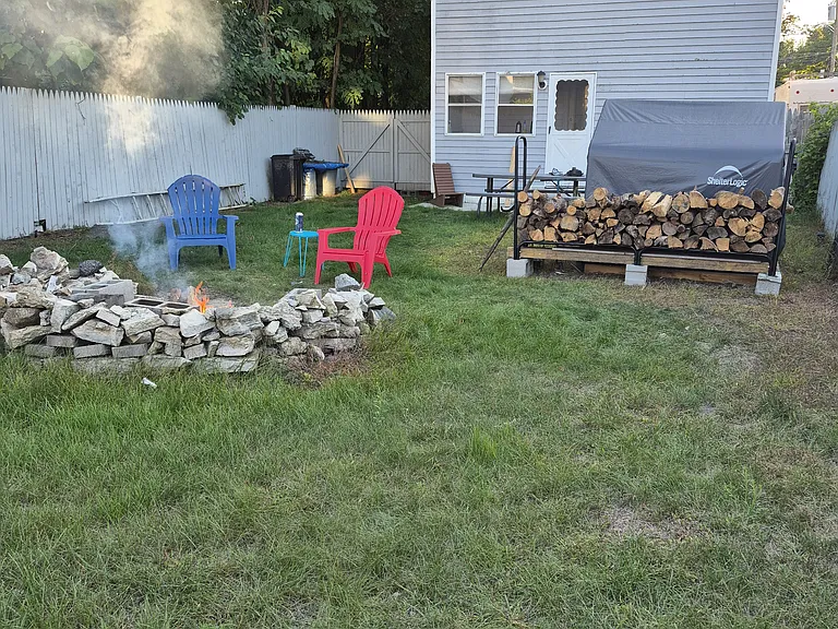 Backyard to house with firepit