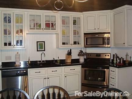 Kitchen
						:
						Custon cabinets, til floor, wet bar, granite countertops