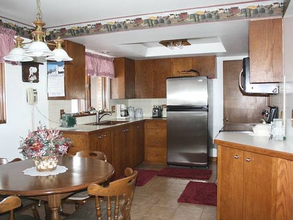 Another view of the kitchen showing the dining area.