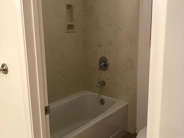 Full bath attached to downstairs bedroom