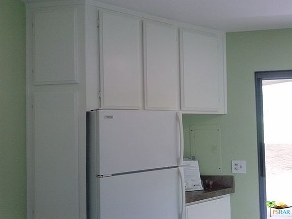 Large refrigerator and plenty of cupboard space