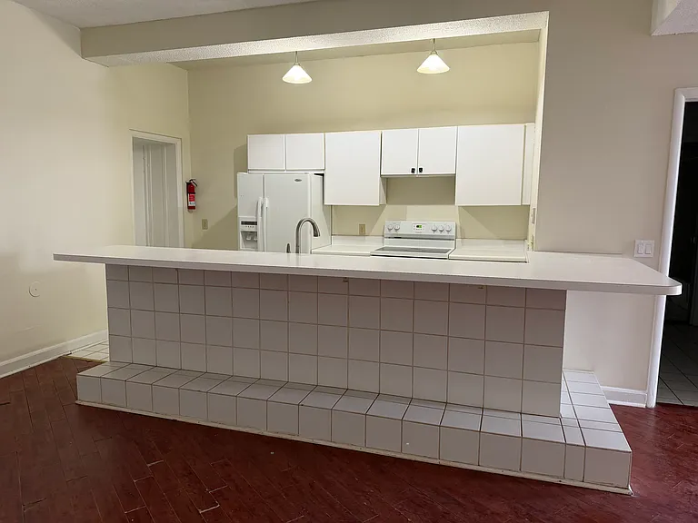 Kitchen has lots of cabinets & storage space. Open Floorplan. Huge kitchen. Great natural light! New appliances, upscale kitchen faucet.