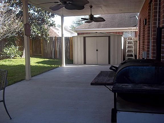 GORGEOUS COVERED PATIO WITH CEILING FANS &STORAGE SHED STAYS