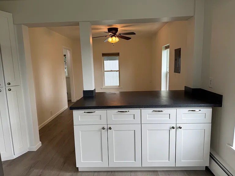 Kitchen bar looking into dining room.