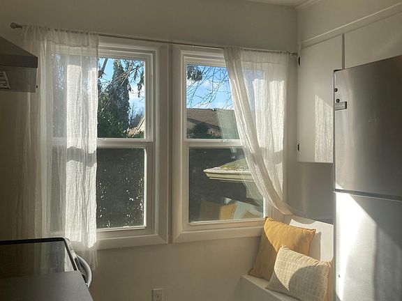 Kitchen windows with seating nook.