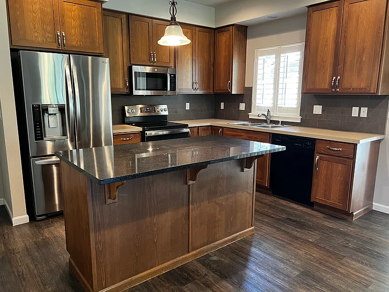 Beautiful kitchen with 42" cabinetry, Stainless appliances and large granite island with room for seating.