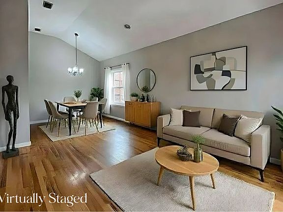 Living Room/ Dining Area high vaulted ceiling - Virtually Staged