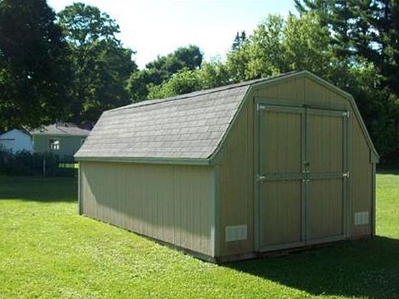 The spacious backyard has a nice oversized shed with wood floor to allow for additional storage and lawn equipment.  
