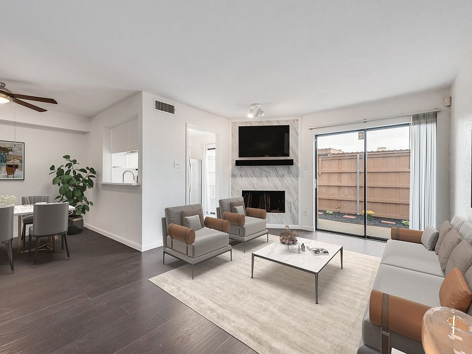 Living Room Virtually Staged View of Dining Area, Kitchen Entry and Patio Entry