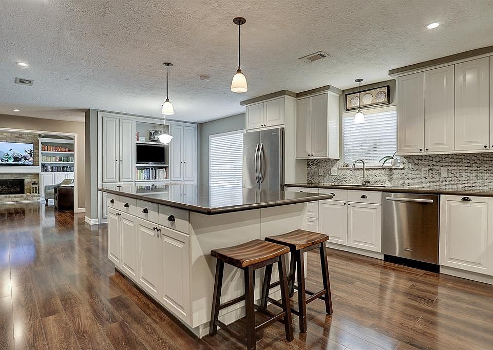 Tastefully updated with gleaming engineered wood flooring. Opens to breakfast room and living room.