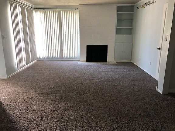 Living room with wood burning fireplace