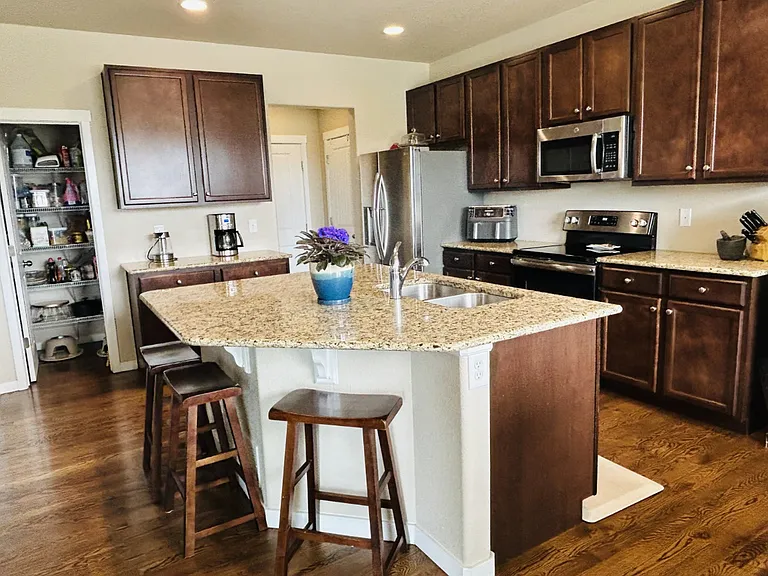 A large granite island is outstanding for entertaining!