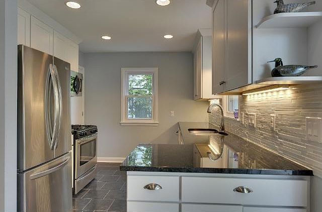 Spacious kitchen with stainless steel appliances.