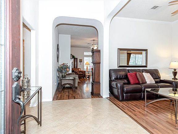 Entryway opens up to the formal dinning room and sitting area that leads into the kitchen