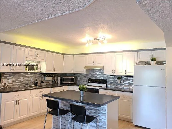 2061 NW 47th Ter #205 — Photo 30