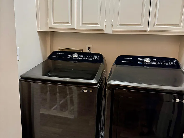 Full-size washer and dryer in second level hall