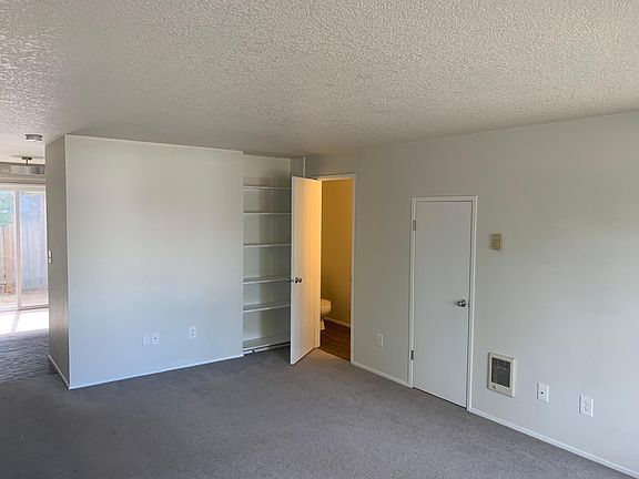 Living room with 1/2 bathroom.