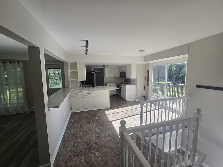Sliding glass door allows easy access to the deck and backyard