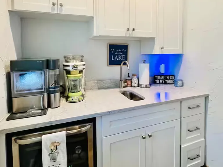 Kitchenette with coffee pot and small sink.