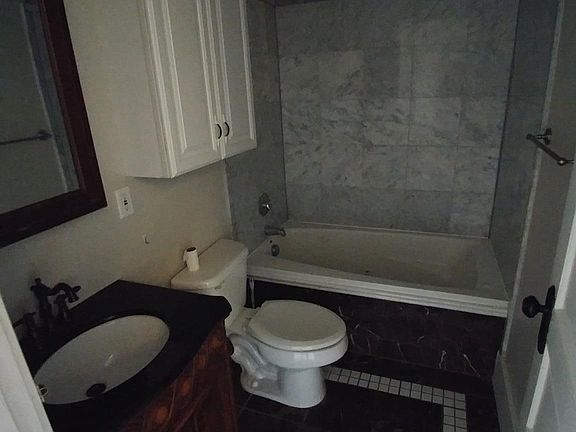Bathroom with jet tub and marble surround