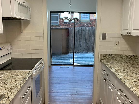 Updated Kitchen with Access to Large Dining Room and Private Patio/Yard.