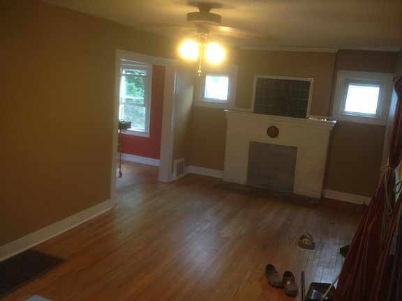 Living Room, This fireplace is non working, Overhead fan light, two small windows and three large windows